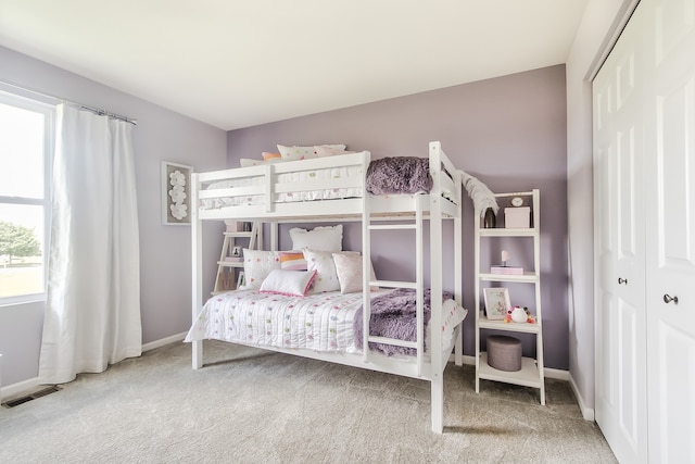 bedroom with a closet and carpet floors