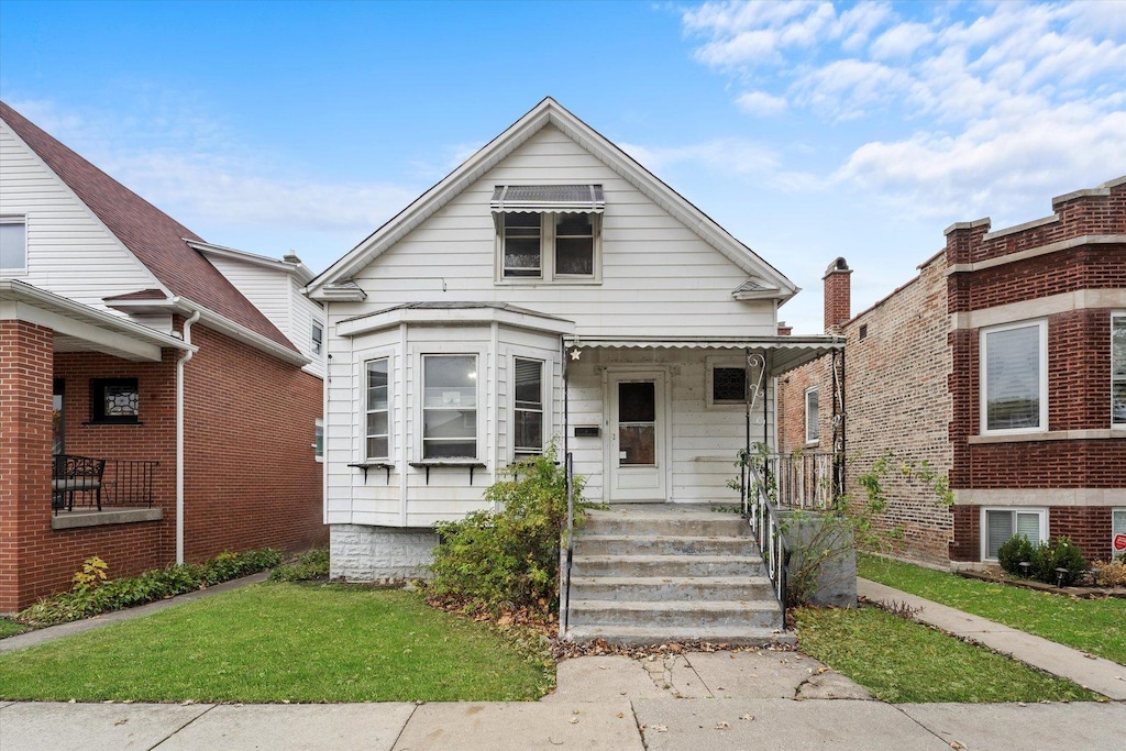 2222 Highland Ave, Berwyn, IL 60402 - view of front facade featuring a front yard