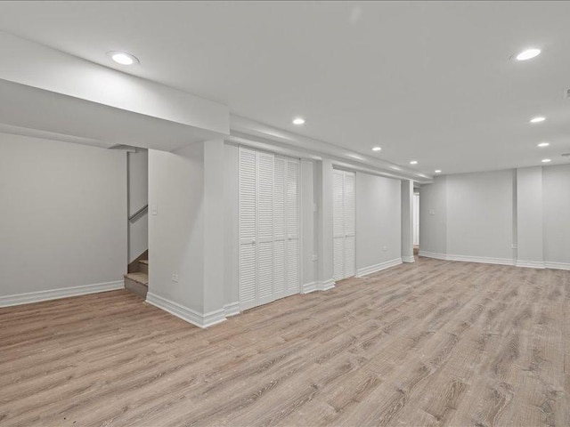 basement featuring light hardwood / wood-style floors