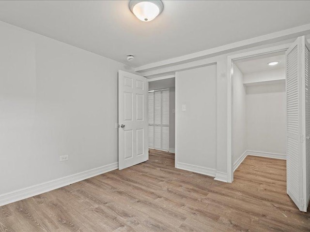 unfurnished bedroom with light wood-type flooring