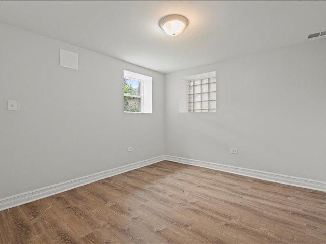 unfurnished room featuring light hardwood / wood-style floors