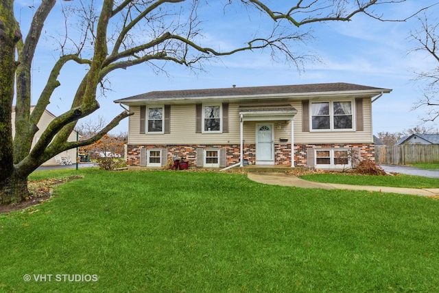 bi-level home with a front yard