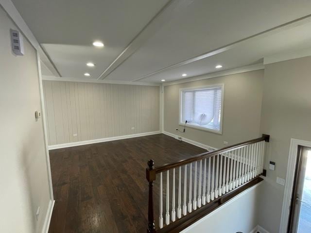 interior space with baseboards, dark wood-style flooring, and recessed lighting