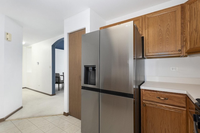 kitchen with stainless steel refrigerator with ice dispenser