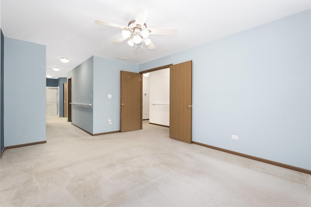 empty room with light carpet and ceiling fan