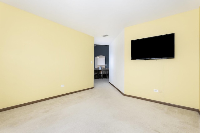 empty room with light colored carpet