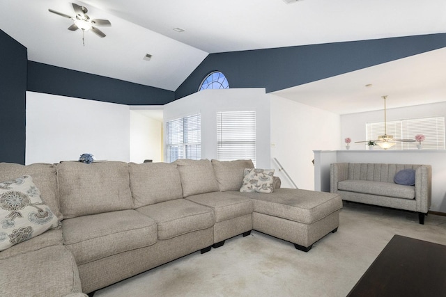 carpeted living room featuring ceiling fan and lofted ceiling