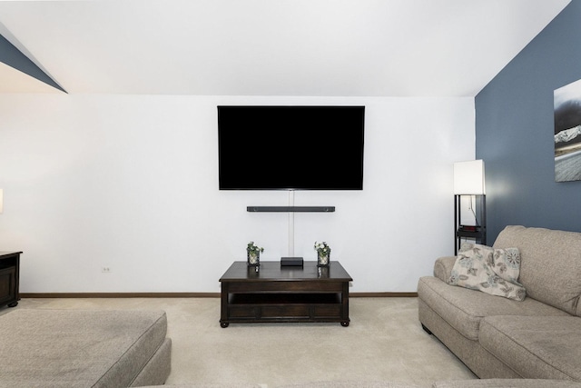 carpeted living room featuring lofted ceiling