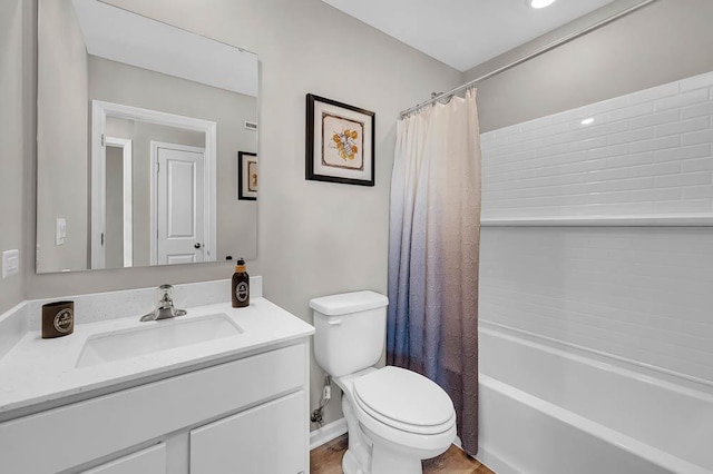 full bathroom with shower / bath combination with curtain, toilet, and vanity