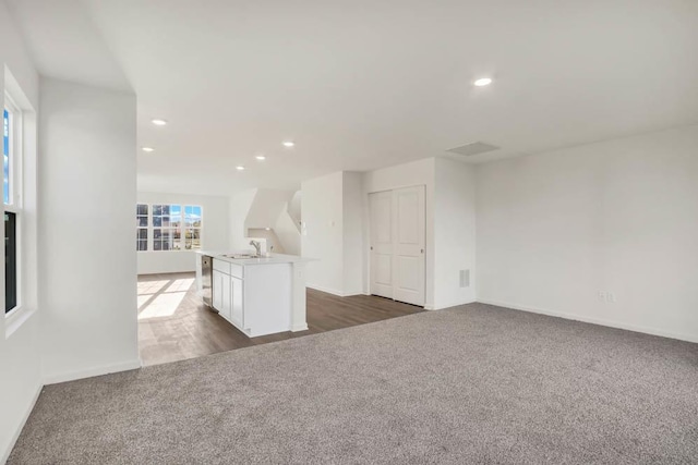 interior space with dark hardwood / wood-style flooring and sink