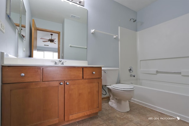 full bathroom with shower / bath combination, tile patterned floors, vanity, ceiling fan, and toilet