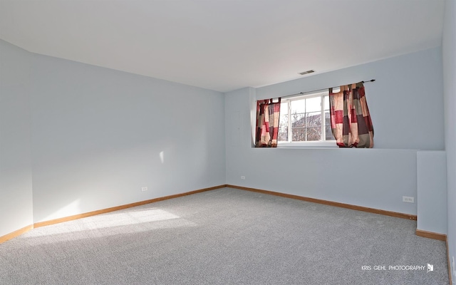 unfurnished room featuring carpet flooring