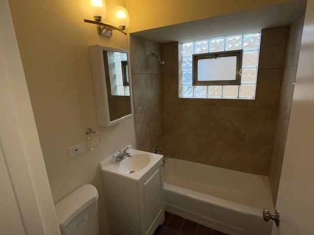 full bathroom with shower / tub combination, vanity, and toilet