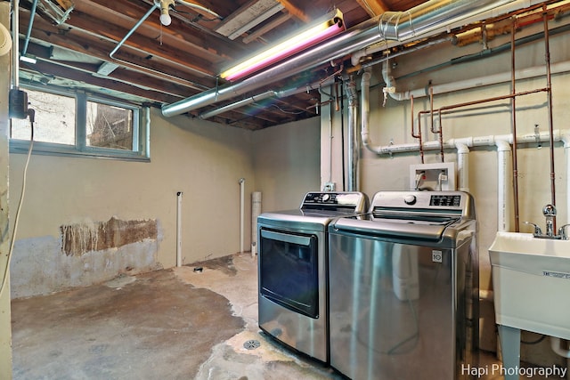 laundry area featuring washer and dryer and sink