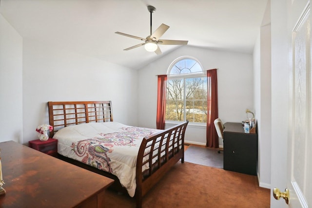 bedroom with ceiling fan, carpet floors, and vaulted ceiling