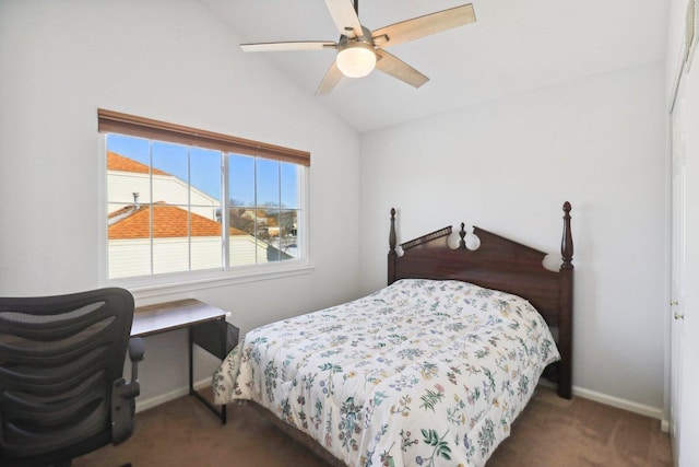 carpeted bedroom featuring vaulted ceiling and ceiling fan