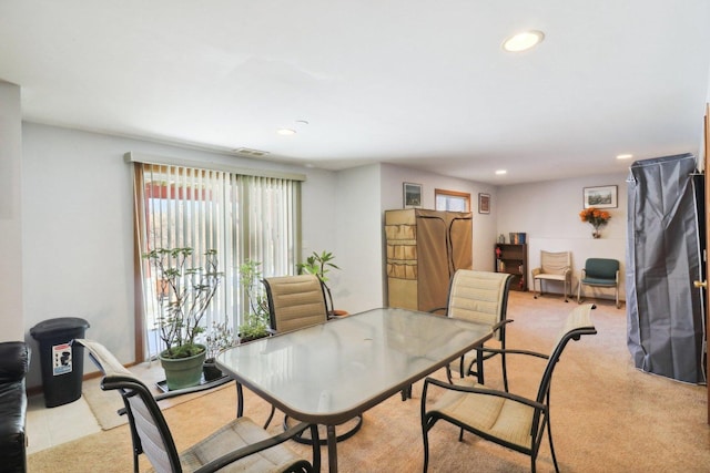 view of carpeted dining area