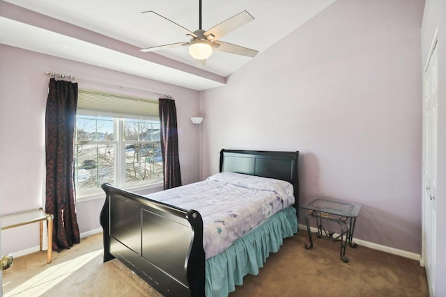 carpeted bedroom featuring vaulted ceiling and ceiling fan