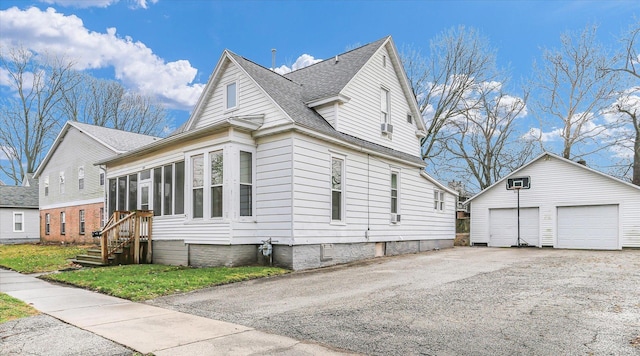 view of property exterior featuring an outdoor structure and a garage