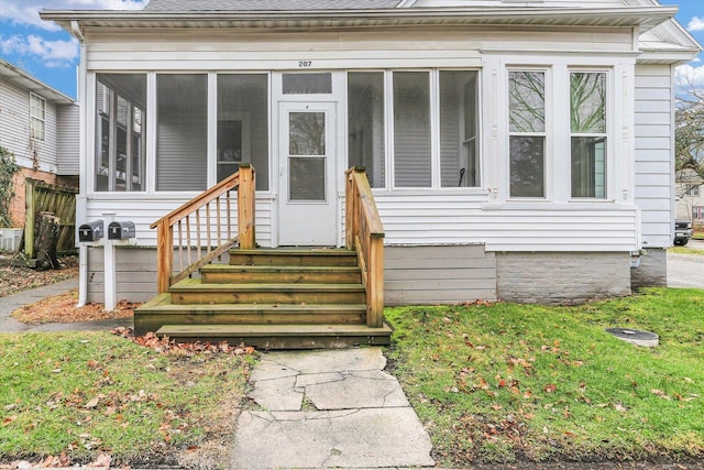 view of front facade with a sunroom