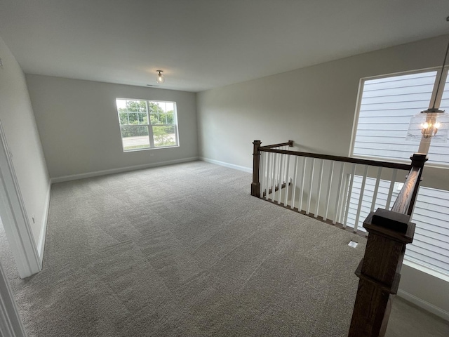 unfurnished room featuring carpet flooring