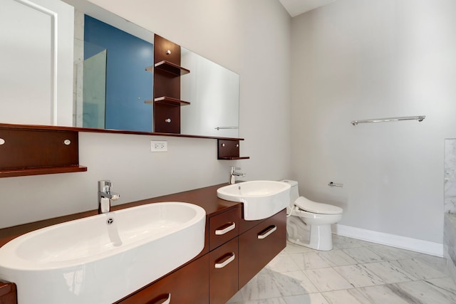 bathroom with toilet and vanity