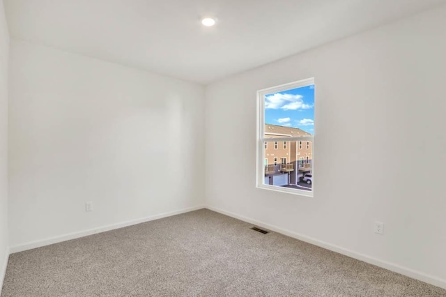 unfurnished room with carpet floors