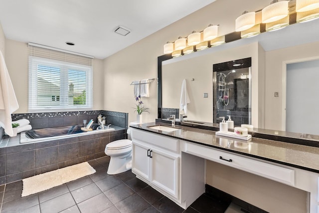 full bathroom with tile patterned floors, vanity, toilet, and shower with separate bathtub