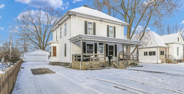 view of front of home featuring a garage and an outdoor structure