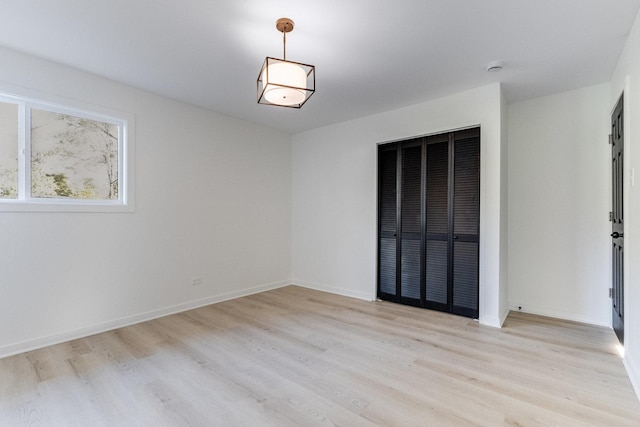 spare room featuring light hardwood / wood-style flooring