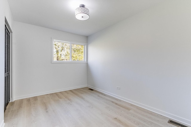 unfurnished room featuring light wood-type flooring