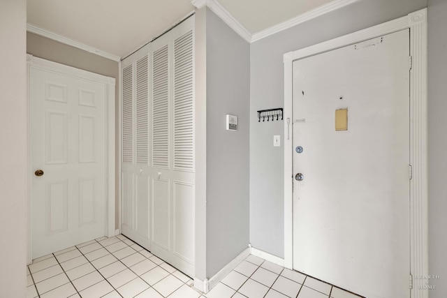 tiled foyer with ornamental molding