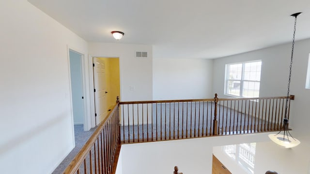 corridor with carpet floors