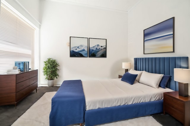 carpeted bedroom featuring ornamental molding