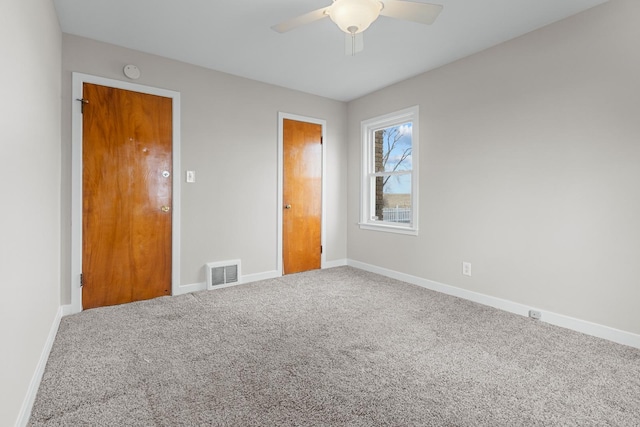 unfurnished bedroom with carpet flooring, ceiling fan, and a closet