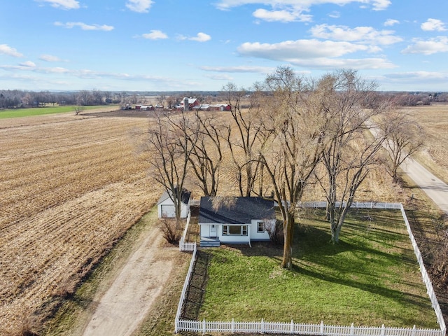 birds eye view of property with a rural view