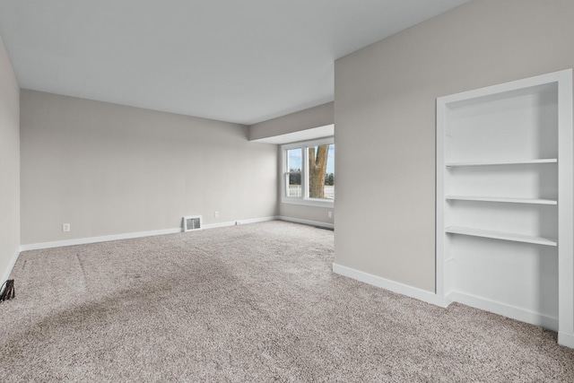 unfurnished living room with carpet flooring