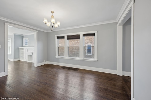 unfurnished dining area with dark hardwood / wood-style floors, ornamental molding, and a chandelier