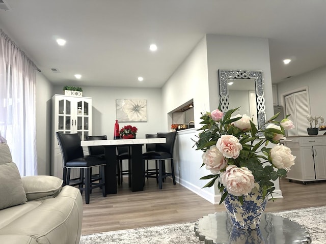 dining area featuring light wood-type flooring