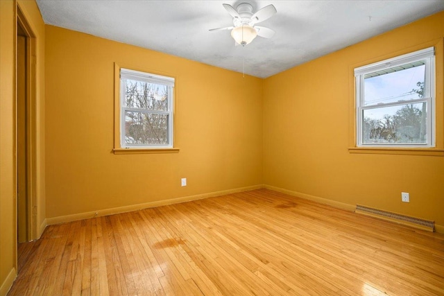 empty room with light hardwood / wood-style floors and ceiling fan