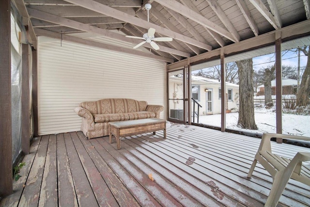 sunroom / solarium featuring vaulted ceiling with beams, ceiling fan, and wood ceiling