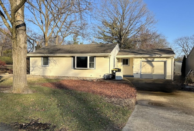 single story home featuring a garage