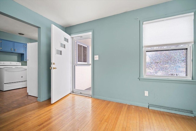 spare room featuring hardwood / wood-style flooring