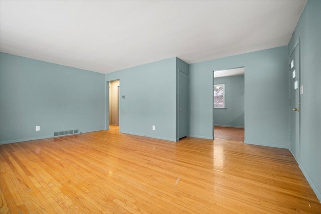 unfurnished room with light hardwood / wood-style floors