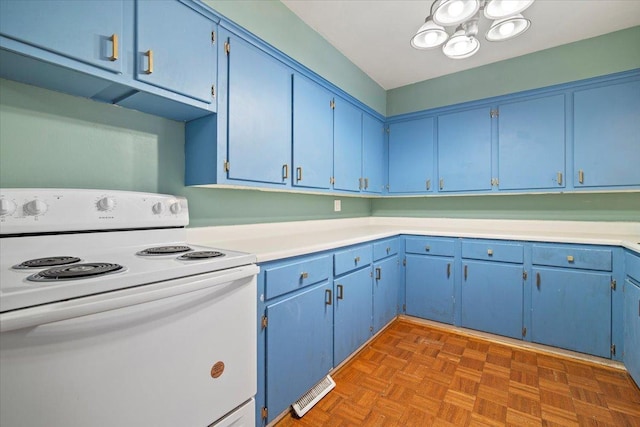 kitchen featuring blue cabinetry, electric range, and dark parquet floors