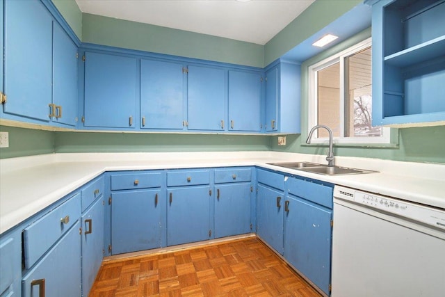 kitchen with blue cabinetry, dishwasher, dark parquet flooring, and sink