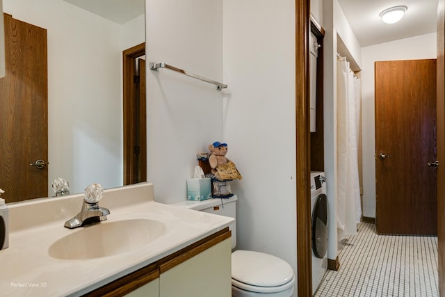 bathroom with tile patterned floors, vanity, washer / clothes dryer, toilet, and lofted ceiling