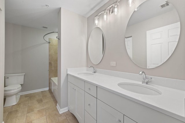 full bathroom with vanity, tub / shower combination, and toilet