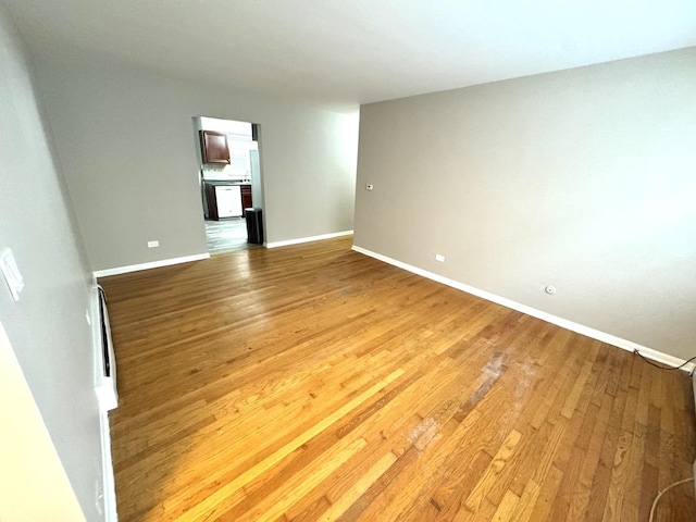 unfurnished living room featuring hardwood / wood-style flooring