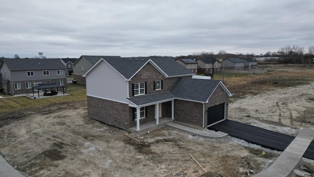 view of front of property featuring a garage